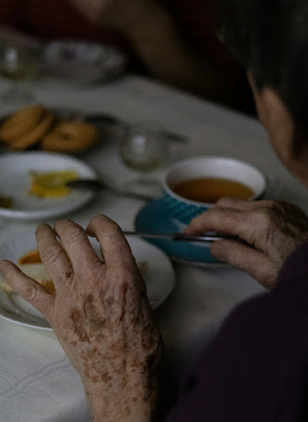 Seniors enjoying a friendly tea gathering around a table