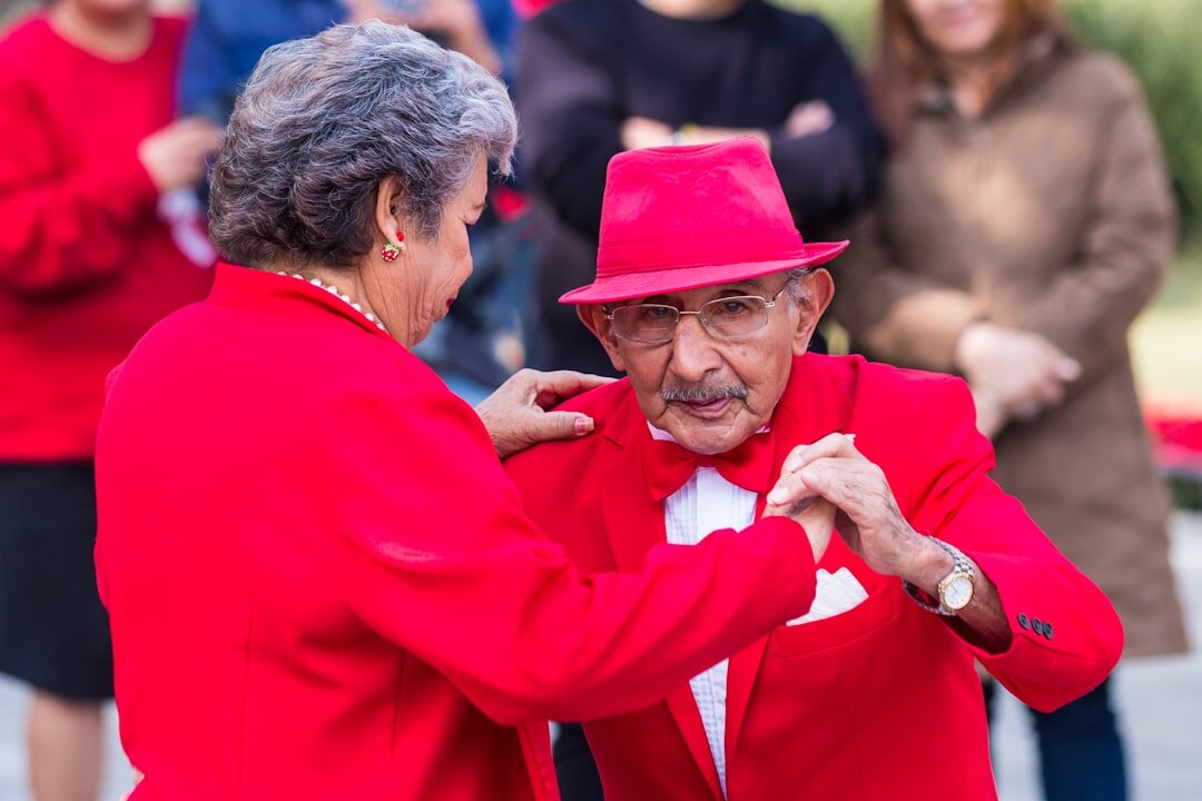 Senior couples dancing together in a community hall