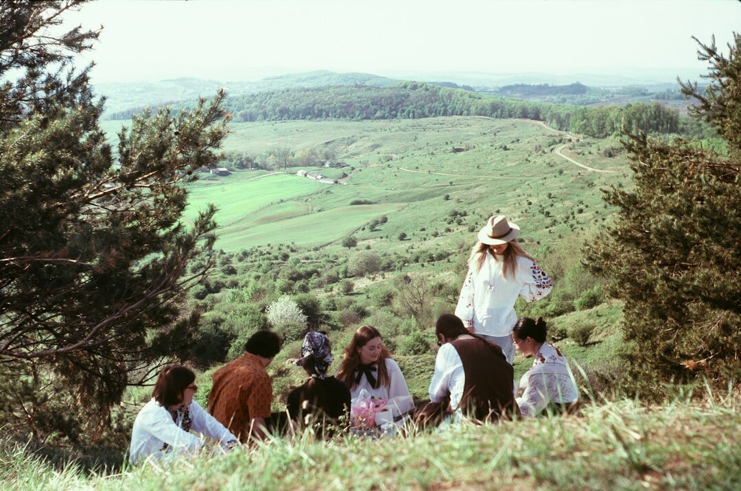 Group of seniors on a countryside excursion admiring the view
