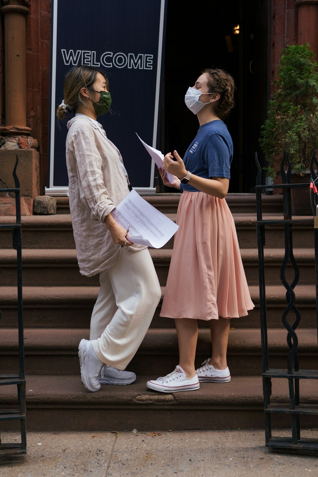 Club member warmly welcoming a new senior visitor at the entrance