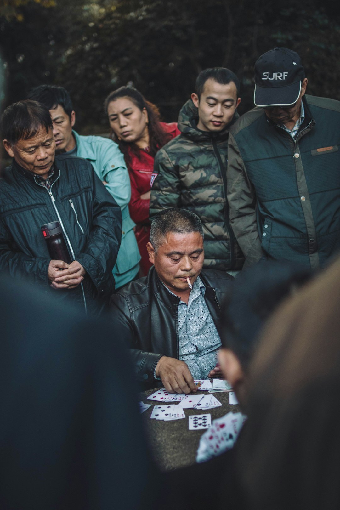 elderly people playing cards