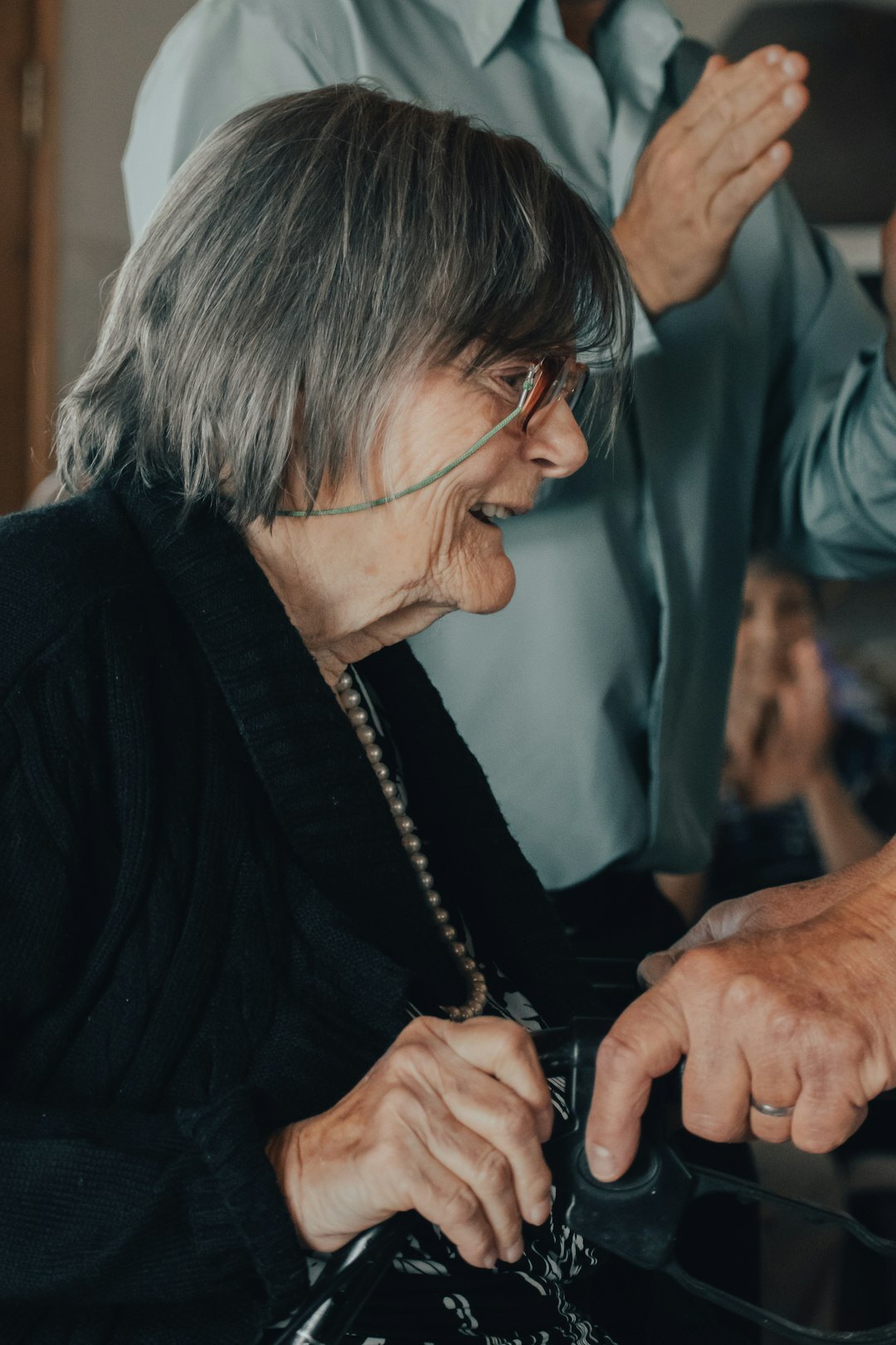 Senior woman learning to use a computer with a helpful instructor
