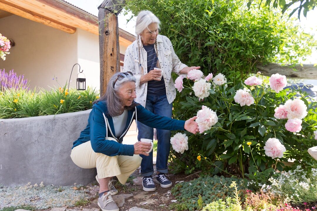 seniors gardening together outdoors